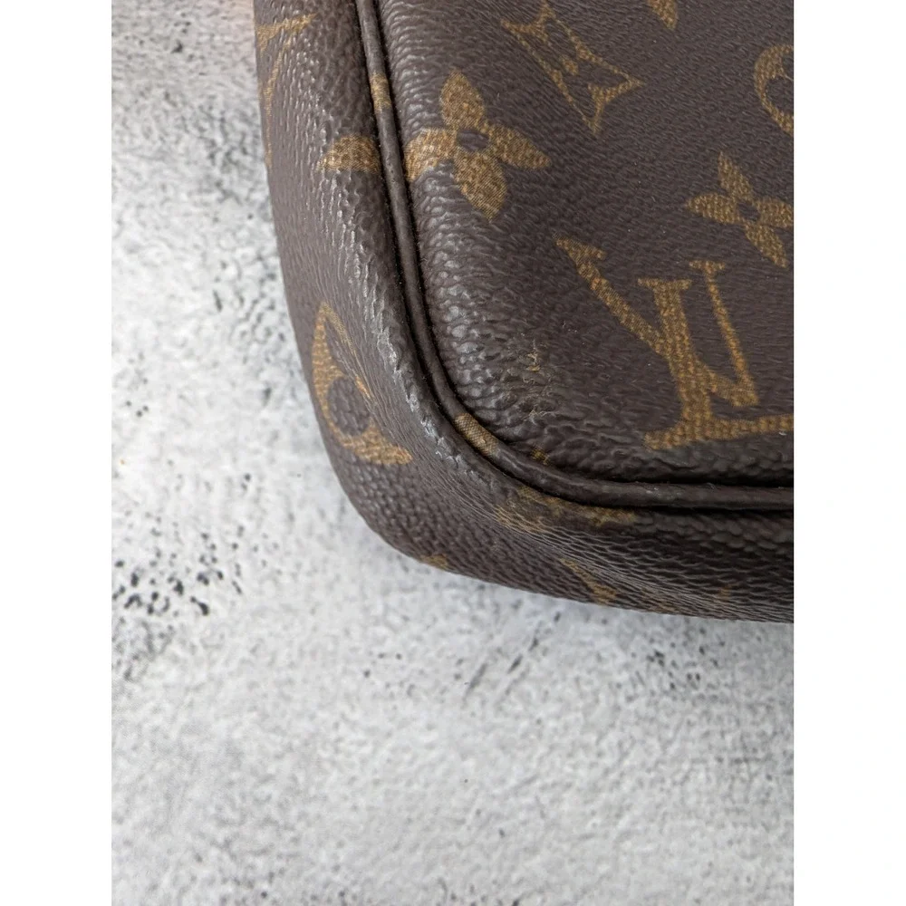 Pochette Accessories with COA crossbody strap and dust bag.